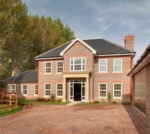 Photo of bespoke designed residential home with garage