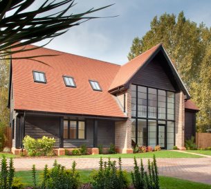 Photo of modern bespoke designed family home with glass frontage